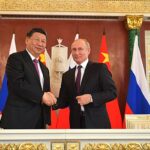 Vladimir Poutine et Xi Jinping lors d’une rencontre officielle en 2019, illustrant le soutien diplomatique conjoint de la Russie et de la Chine au Venezuela face aux pressions internationales.