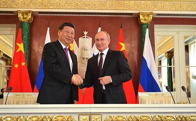 Vladimir Poutine et Xi Jinping lors d’une rencontre officielle en 2019, illustrant le soutien diplomatique conjoint de la Russie et de la Chine au Venezuela face aux pressions internationales.